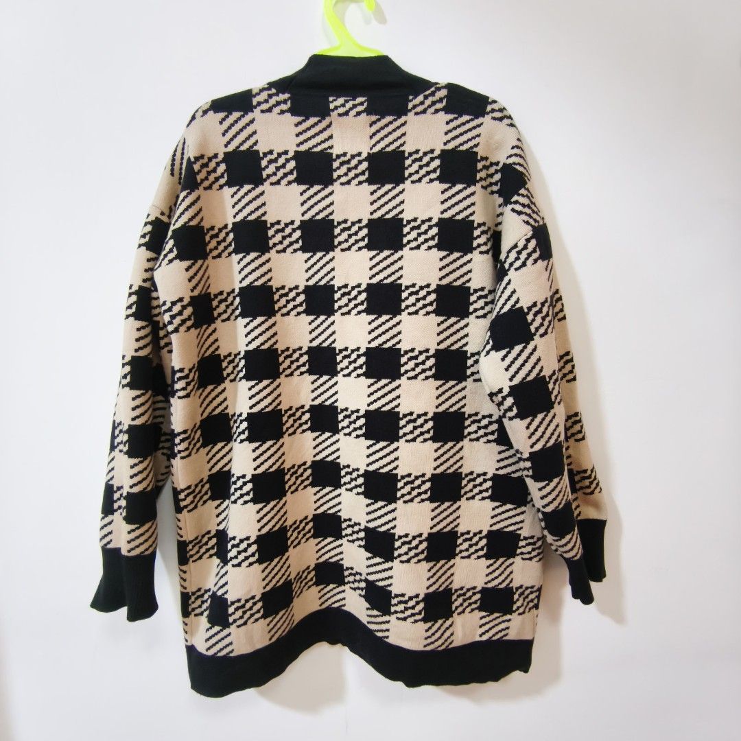 Sandro Paris Checkered Knit Cardigan Black Beige (Category: Coats, Jackets and Outerwear) located in Quezon City. Submitted by inrelationthrift (Listing ID 1470190865, Image 2). Description: -Sandro Paris knit cardigan in a bold black and beige checkered pattern. -V-neck style with black button placket and matching trim on pockets and cuffs. -Gold tone buttons down the front and on front pockets. Warm oversized fit with long sleeves. -Classic Par