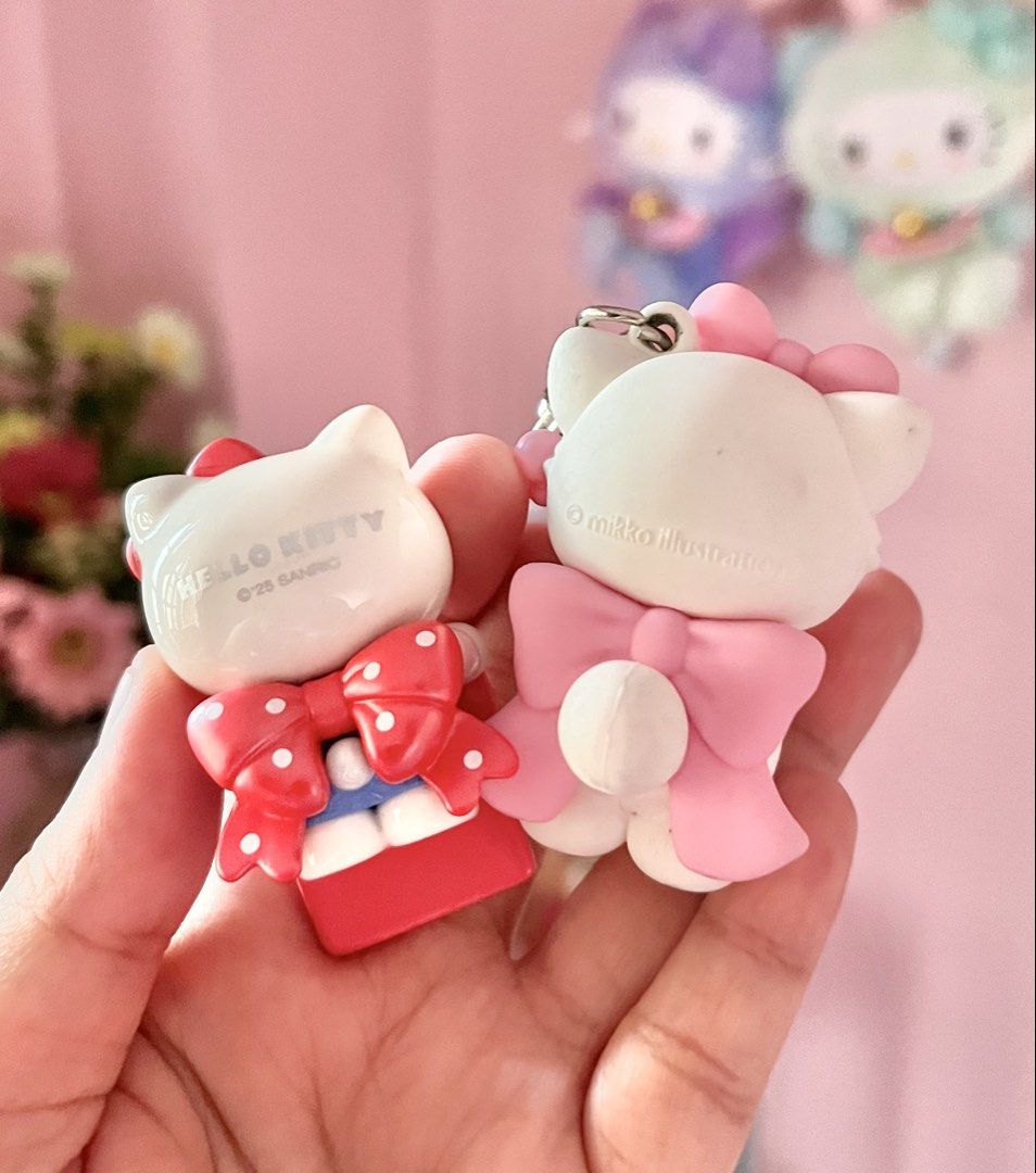 Sanrio Hello Kitty and Mikko Illustration Keychains (Category: Character Goods) located in Imus. Submitted by muyingyingyinggg (Listing ID 1470237744, Image 2). Description: - Set of 2 cute collectible keychains: Sanrio Kitty and Mikko Illustration white cat with a pink bow - Authentic items with visible copyright marks on the back - Perfect accessories to style your bags, purses, or keys - Compact size, easy to carry and show off.
