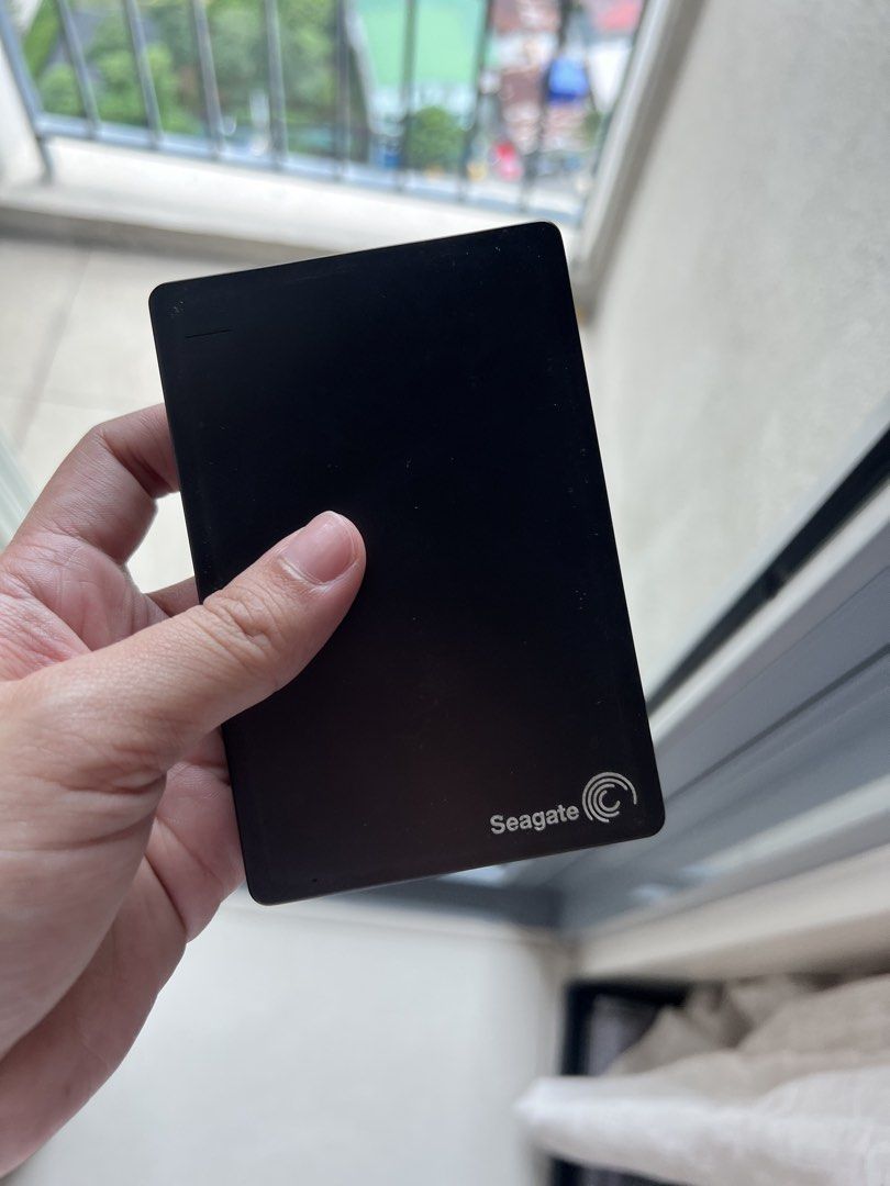 Seagate Backup Plus Portable Drive 1TB (Category: Hard Disks & Thumbdrives) located in Makati City. Submitted by jrj00 (Listing ID 1470189926, Image 2). Description: - Model: Seagate Backup Plus SRD00F1 - Storage Capacity: 1TB - Color: Black - Condition: Fully working and tested - Includes: Protective blue rubber sleeve and WD zipper pouch - Perfect for portable file storage and daily backups.