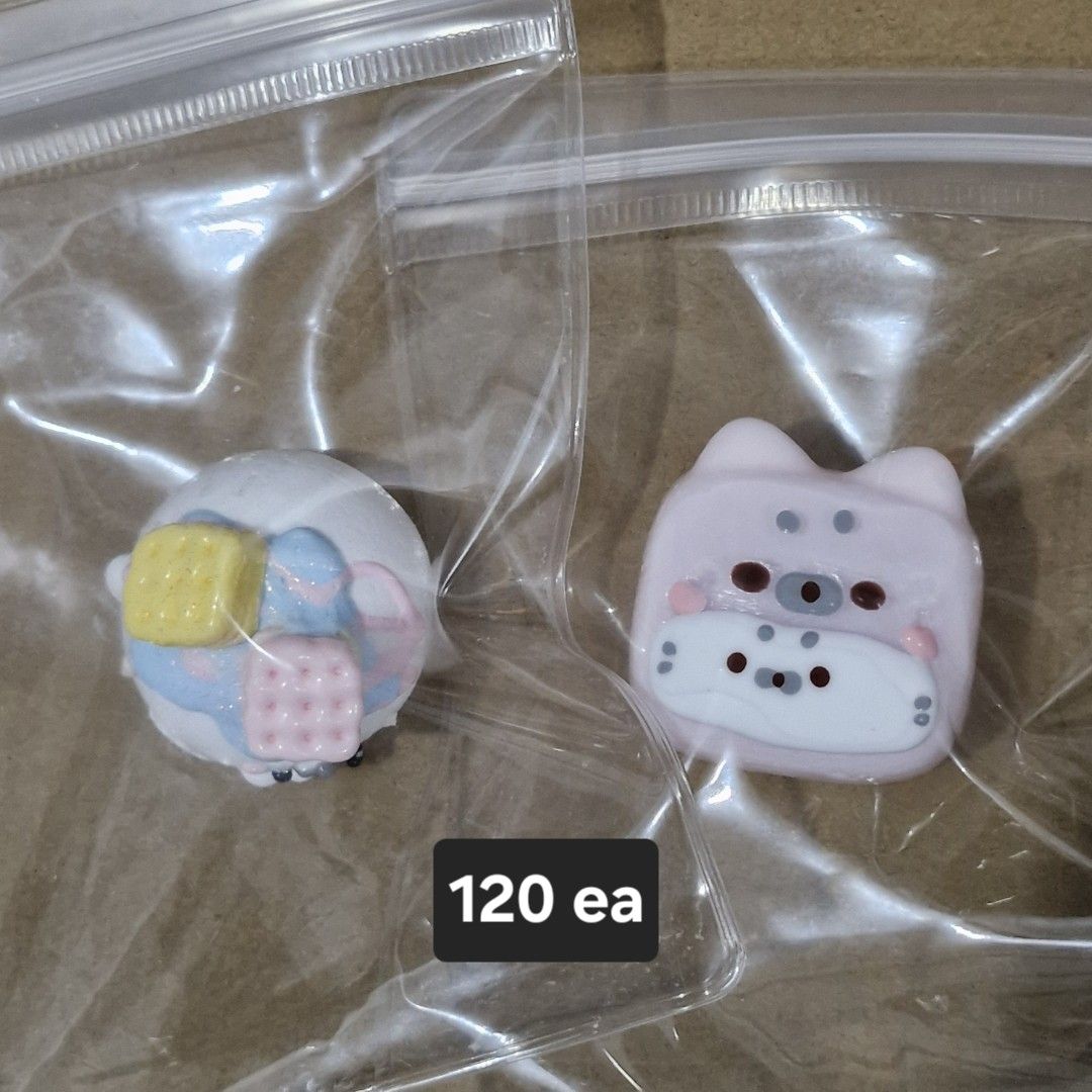 Seals Taba Squishy (Category: Interactive Toys) located in Manila. Submitted by mochacchi (Listing ID 1470267926, Image 1). Description: - Handmade resin charms (sealed in plastic bags) - Available styles: Colorful pastel block (round) or Pink cat (square) - Price: ₱120 each - Perfect for decorating bags, keys, or phone straps.