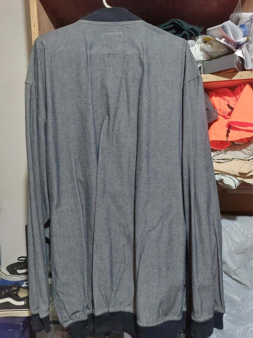 Sean John Grey Bomber Jacket Mens Size (Category: Coats, Jackets and Outerwear) located in Manila. Submitted by yu-jimin (Listing ID 1470199037, Image 2). Description: - Brand: Sean John - Color: Grey with dark ribbed trim - Style: Lightweight bomber jacket with relaxed fit - Details: Front zipper closure, side pockets, and subtle embroidered logo on the chest - Best for: Great layering piece for cooler weather.