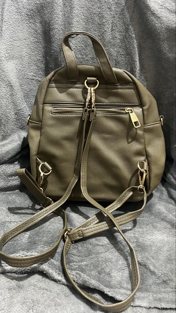 Secosana Olive Green Quilted Backpack with Studs (Category: Backpacks) located in Manila. Submitted by asdfghjkl.mountain (Listing ID 1470277988, Image 3). Description: - Brand: Secosana - Color: Olive Green - Material: Textured faux leather with quilted hexagonal front pattern - Hardware: Gold-tone accents with Secosana logo plate & silver-toned metal stud details on the front pocket - Storage: Multiple zipper compartments on the front and back 