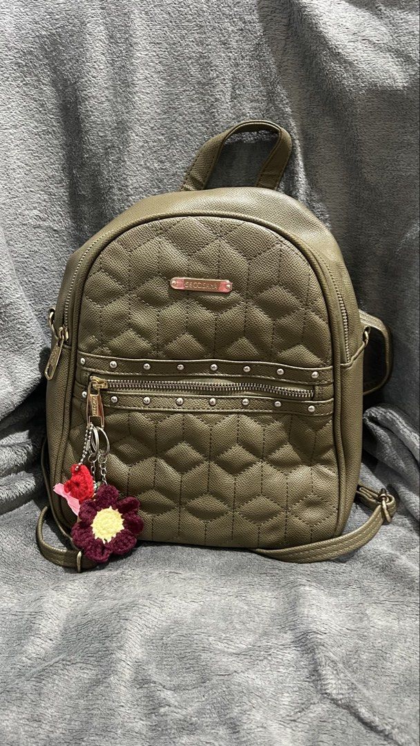 Secosana Olive Green Quilted Backpack with Studs (Category: Backpacks) located in Manila. Submitted by asdfghjkl.mountain (Listing ID 1470277988, Image 1). Description: - Brand: Secosana - Color: Olive Green - Material: Textured faux leather with quilted hexagonal front pattern - Hardware: Gold-tone accents with Secosana logo plate & silver-toned metal stud details on the front pocket - Storage: Multiple zipper compartments on the front and back 