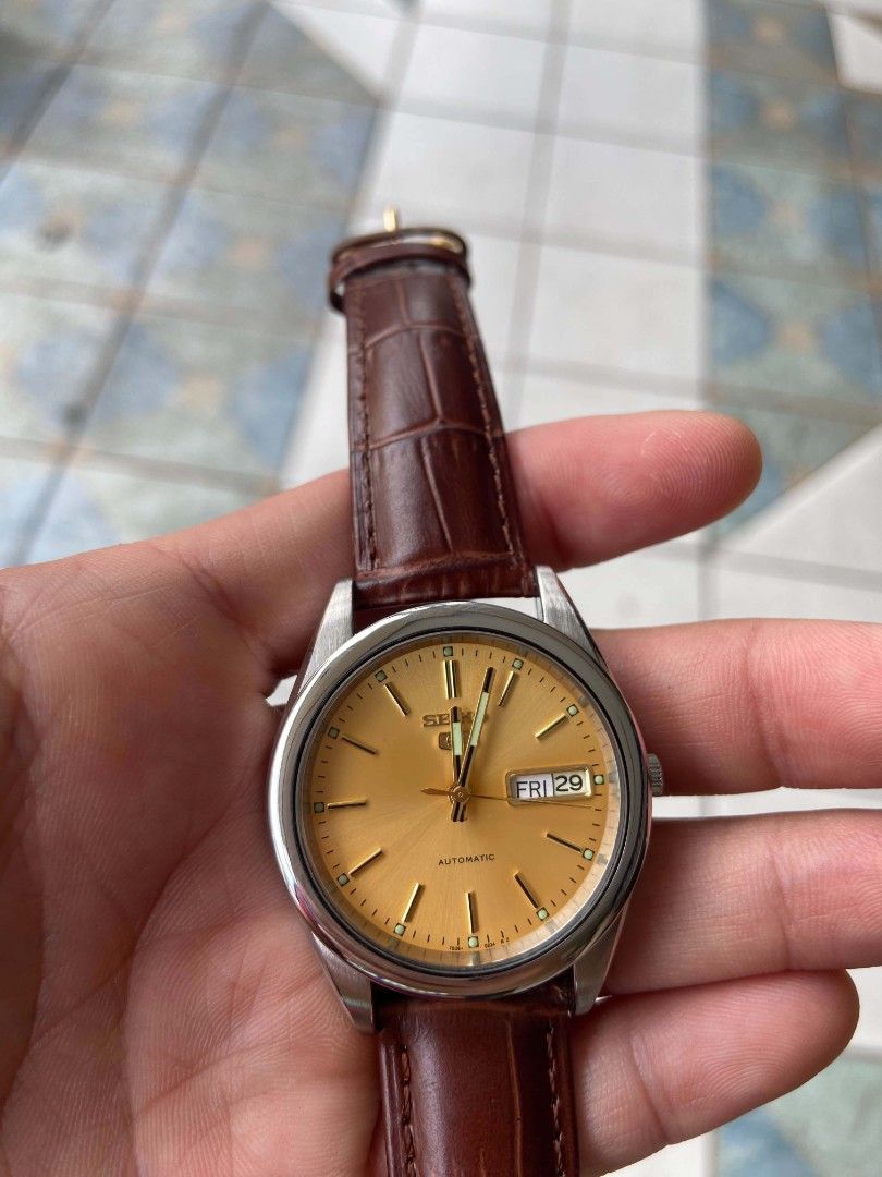 Seiko 5 Automatic Watch Orange Dial Brown Leather Strap (Category: Men's Watches) located in Caloocan City. Submitted by klaudio23 (Listing ID 1470304805, Image 1). Description: - Eye-catching bright yellow dial - Durable stainless steel case - Stylish brown embossed leather strap - Convenient day and date window at the 3 o'clock position - Discreet crown tucked at the 4 o'clock position - Exhibition case back showing the automatic movement - Per