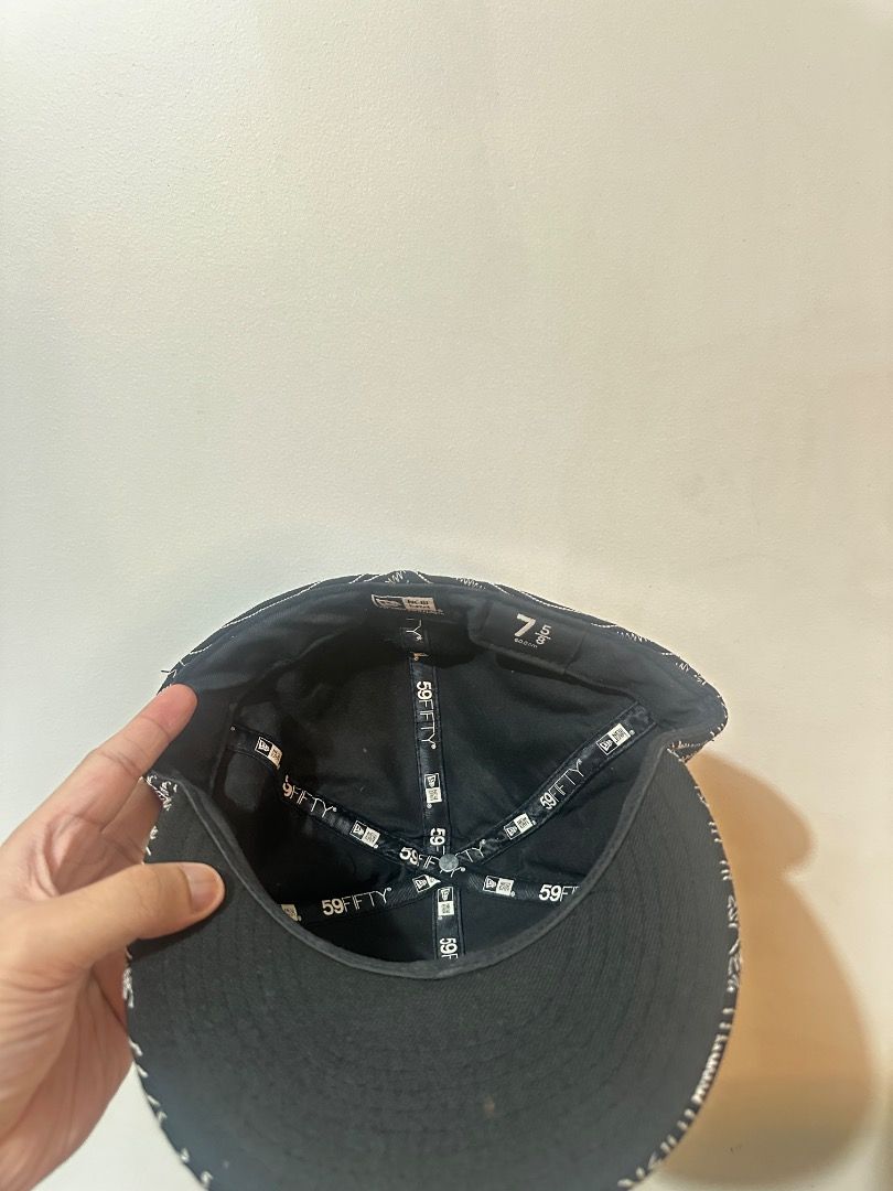 Supreme x New Era Uptown Box cap (Category: Caps & Hats) located in Manila. Submitted by abpangilin77577 (Listing ID 1470263511, Image 3). Description: - Brand: Supreme x New Era - Style: Fitted cap - Size: 7 5/8 - Color/Design: Black and white patterned with intricate stitching all over - Logo: Iconic embroidered box logo on the front - Condition: lighlty used, but stored in the cabinet for a long time. NOTE: This was a gift to me by my cousin b