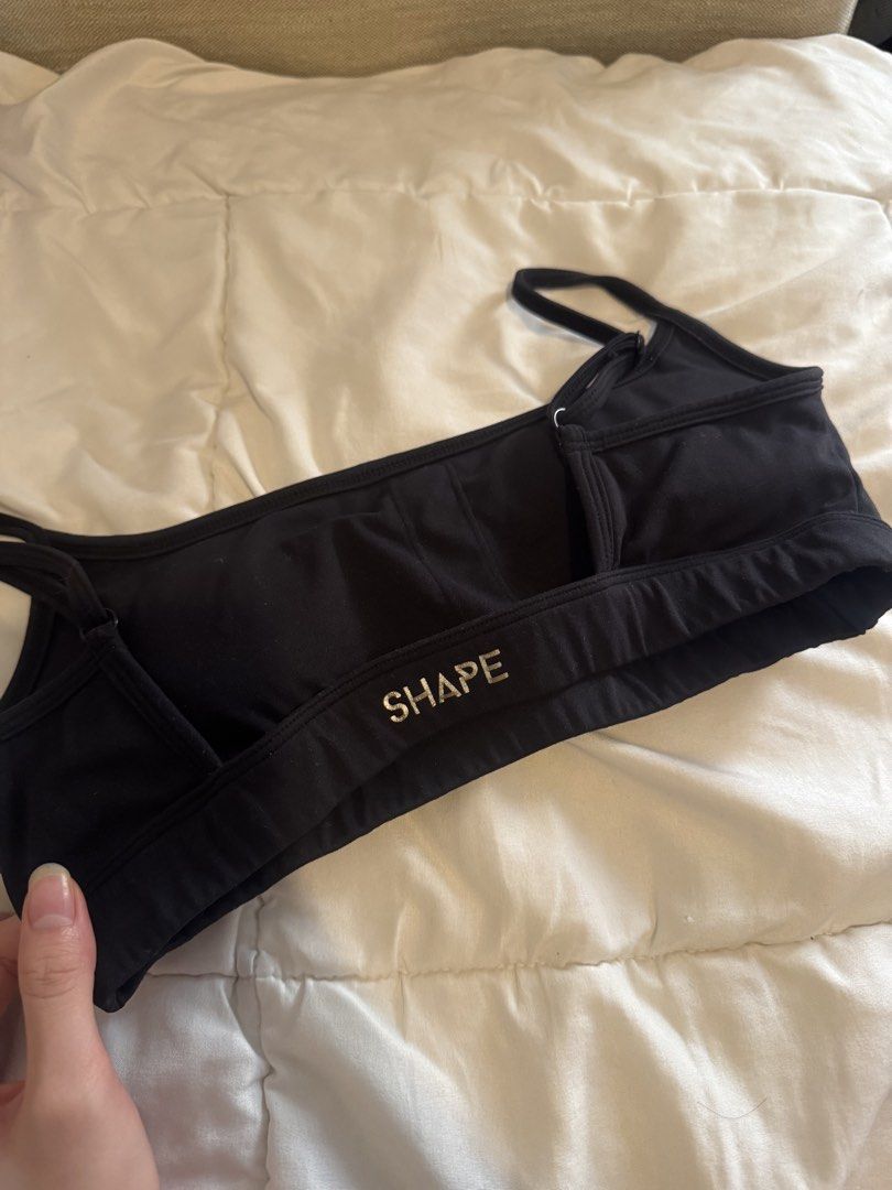 Shape Active Cloud Black Sports Bra (Category: Activewear) located in Pasig City. Submitted by vanillaice__ (Listing ID 1470242264, Image 3). Description: - Brand: Shape Active - Color: Black - Material: Soft, stretchy cotton fabric - Design: Scoop neckline with thin adjustable straps - Details: Logo printed on the back band - Condition: Worn a few times, still in great shape.