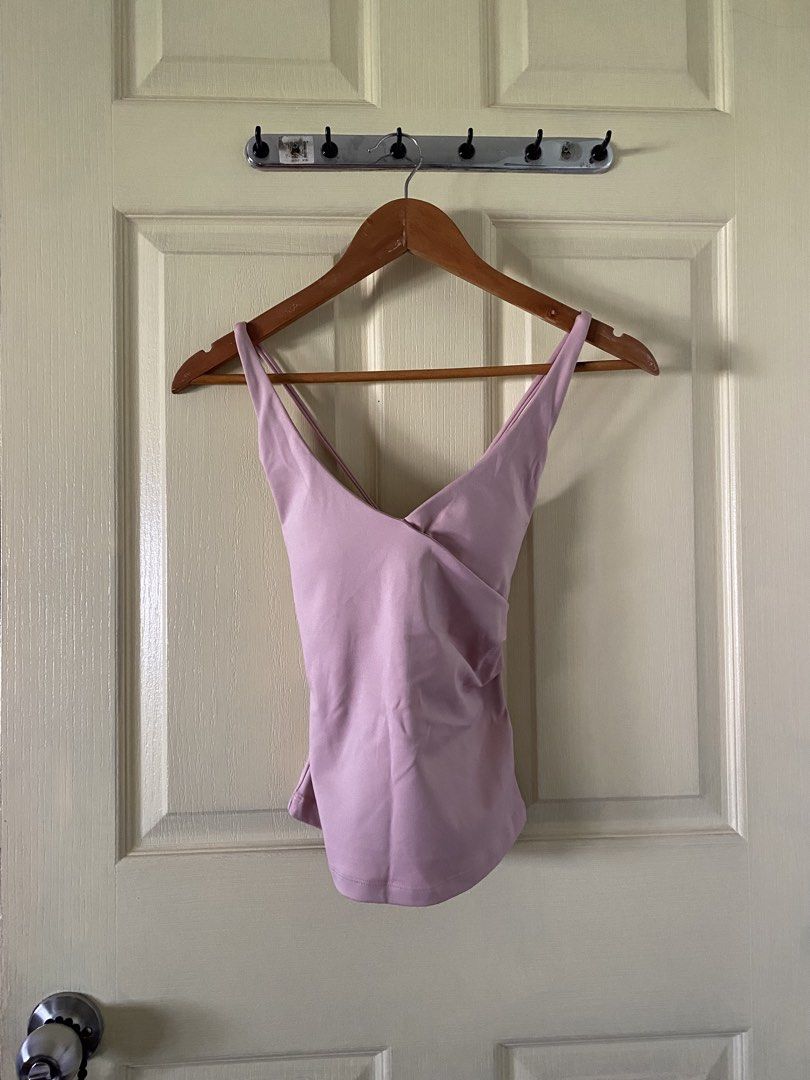 Shape Active Tone Cross Back Tank Top in Rose (Category: Sleeveless) located in Quezon City. Submitted by bananabreadbaby (Listing ID 1470200049, Image 2). Description: Brand new. Only wore to try. - Original price: 1,850. - Brand/Style: Shape Active Tone Cross Back Tank Top - Color: Rose - Design: V-neck wrap front with multi-strap crisscross back and lower back branding - Material: Soft and stretchy fabric - Versatility: Great for workouts, gym