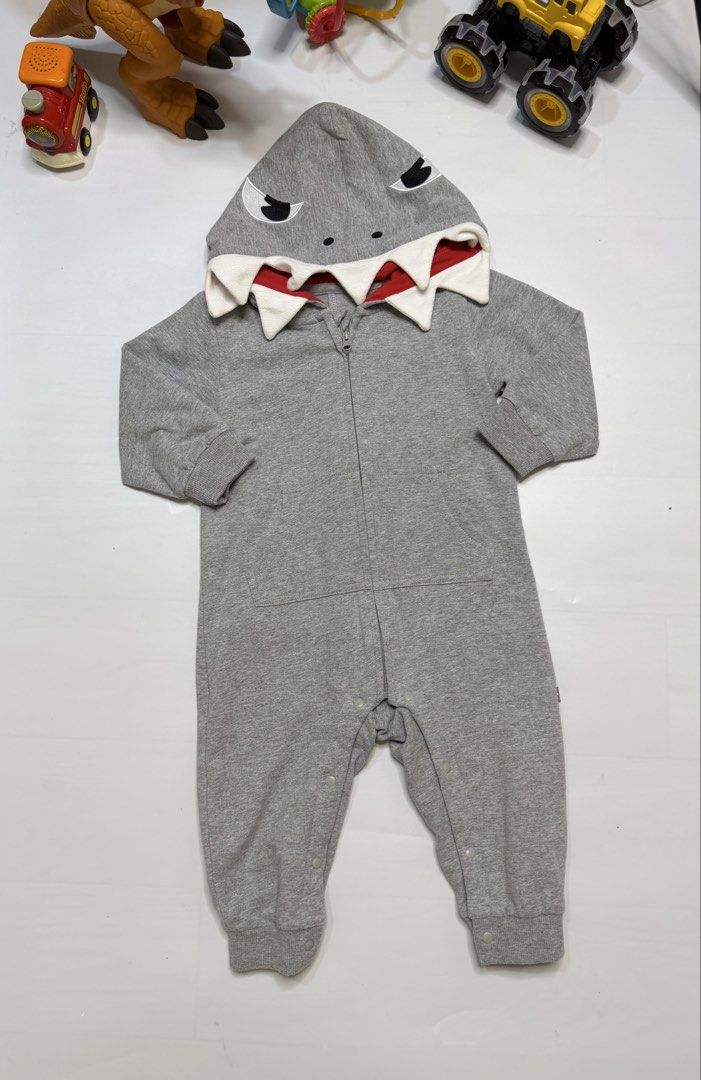 Shark costume (Category: Babies & Kids Fashion) located in Dasmarinas. Submitted by elizmaebau68309 (Listing ID 1470151039, Image 2). Description: Gray hooded baby shark cotton romper with a full-length zipper and 3D teeth details on the hood. Personal preloves Used once 18-24 months Original price in Amazon 1500 .