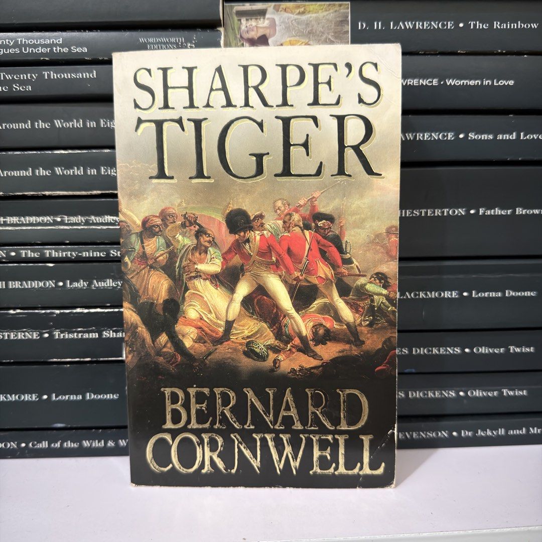 Sharpe's Tiger by Bernard Cornwell Novel Paperback (Category: Storybooks) located in Lingayen. Submitted by readwjane (Listing ID 1470200176, Image 1). Description: - Title: Sharpe's Tiger - Author: Bernard Cornwell - Format: Paperback with striking battle scene cover art - Genre: Classic military adventure / Historical fiction - Setting: India - Condition: Good, well-maintained - Perfect for: Fans of historical fiction and the iconic Sharpe seri