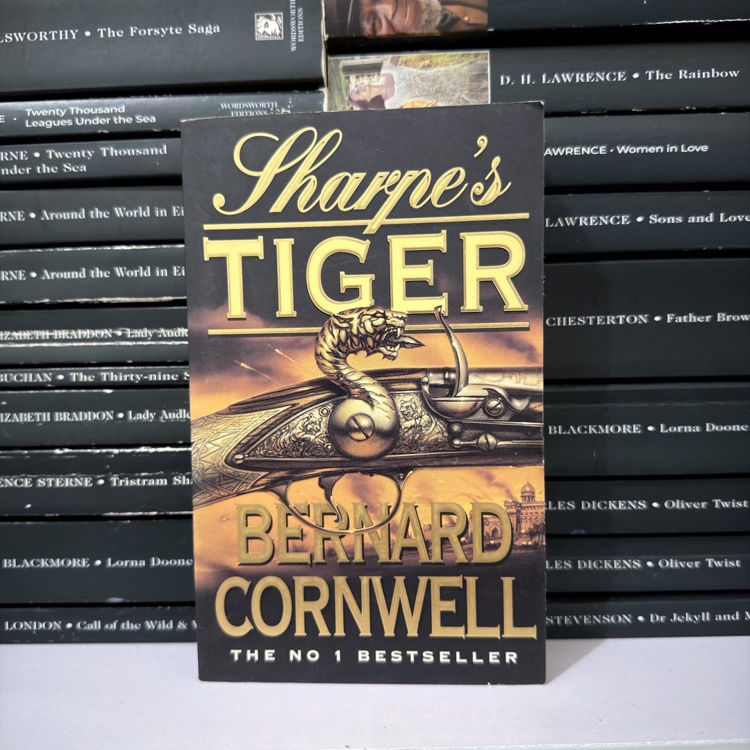Sharpe's Tiger by Bernard Cornwell paperback novel (Category: Storybooks) located in Lingayen. Submitted by readwjane (Listing ID 1470200192, Image 1). Description: - Title: Sharpe's Tiger by Bernard Cornwell - Format: Standard paperback edition - Cover Art: Features a striking tiger-headed flintlock pistol - Condition: Clean pages inside, well-maintained - Genre: Historical military adventure - Perfect for: Fans of action-packed historical ficti
