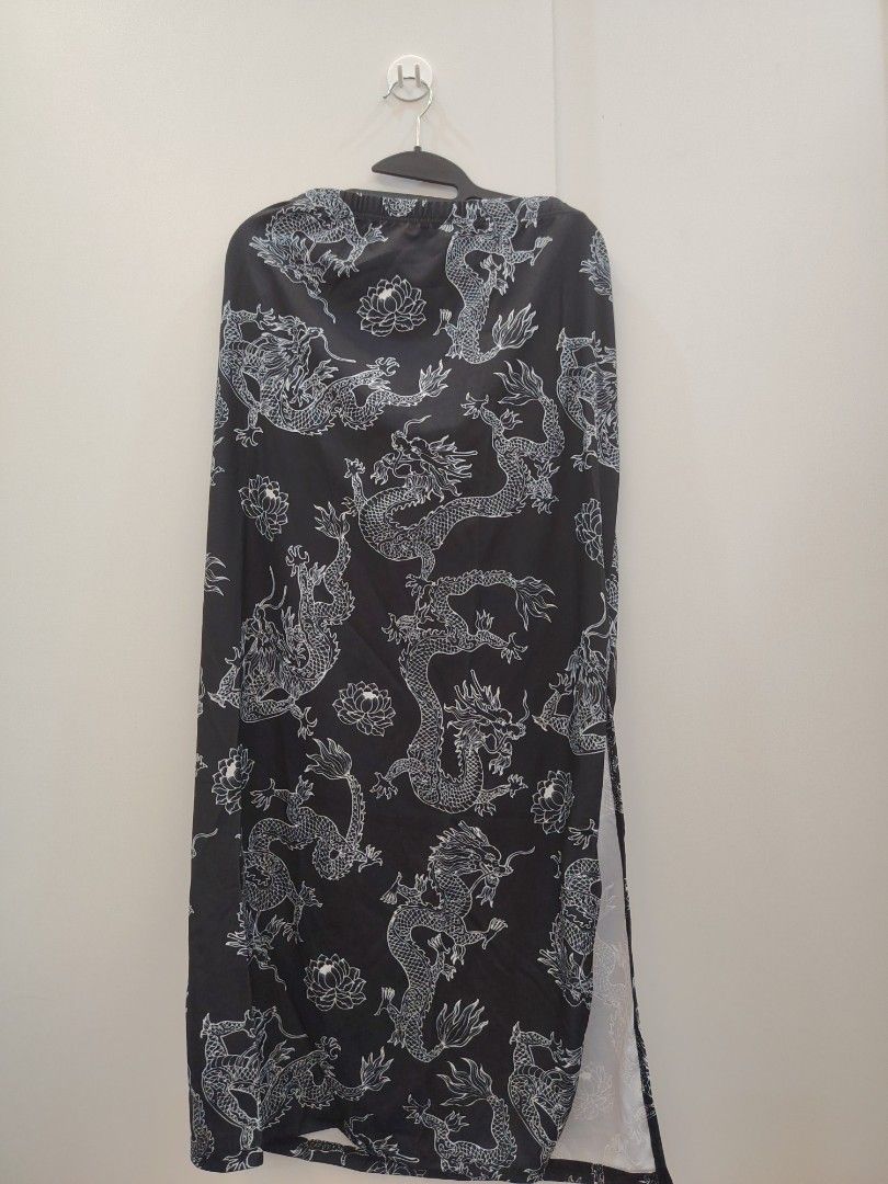 SHEIN Curve Dragon Print Split Maxi Skirt Plus Size (Category: Skirts) located in Manila. Submitted by babeboxtheory (Listing ID 1470290020, Image 2). Description: - Brand: SHEIN Curve - Size: 2XL (Brand new with tag attached) - Design: Black maxi skirt with all-over white Chinese dragon and lotus print - Fit: High waist with comfortable elastic band - Detail: Chic high side slit on the left leg - Material: Lightweight fabric with 5% elastane for
