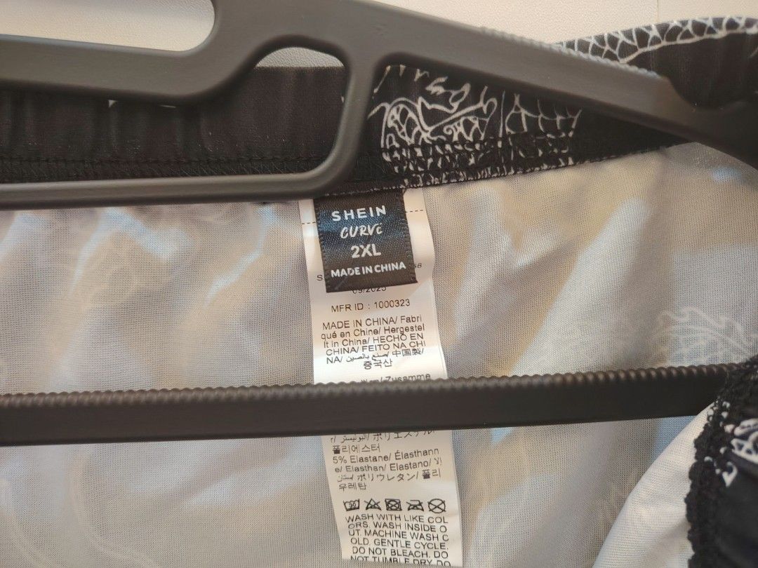 SHEIN Curve Dragon Print Split Maxi Skirt Plus Size (Category: Skirts) located in Manila. Submitted by babeboxtheory (Listing ID 1470290020, Image 3). Description: - Brand: SHEIN Curve - Size: 2XL (Brand new with tag attached) - Design: Black maxi skirt with all-over white Chinese dragon and lotus print - Fit: High waist with comfortable elastic band - Detail: Chic high side slit on the left leg - Material: Lightweight fabric with 5% elastane for
