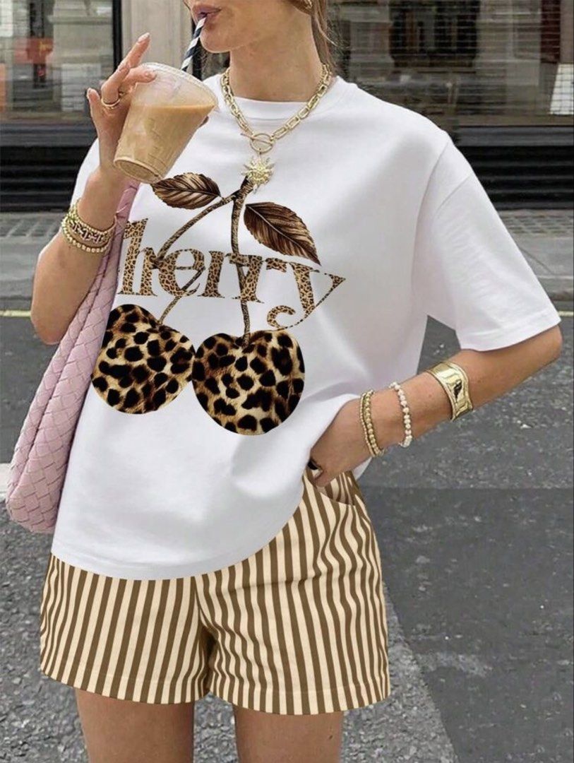SHEIN Leopard Cherry Print White Crop T-Shirt (Category: Shirts) located in Manila. Submitted by dianafayesimbre (Listing ID 1470266494, Image 2). Description: - Size: 10Y on tag but fits xs to medium - Design: White tee with trendy leopard print cherry graphic - Fit: Cropped and short-sleeved - Material: Soft, comfortable cotton - Condition: Brand new - Styling: Easy to pair with your favorite shorts or jeans for a casual look.