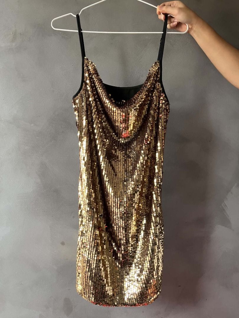 SHEIN Mini Golden Dress (Category: Dresses) located in Caloocan City. Submitted by sejjeong (Listing ID 1470320610, Image 1). Description: gold sequins are only on the front; the back part is plain black .