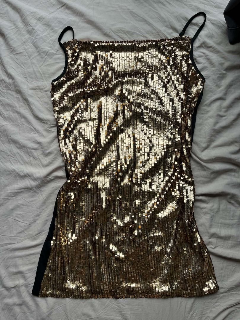 SHEIN Mini Golden Dress (Category: Dresses) located in Caloocan City. Submitted by sejjeong (Listing ID 1470320610, Image 2). Description: gold sequins are only on the front; the back part is plain black .