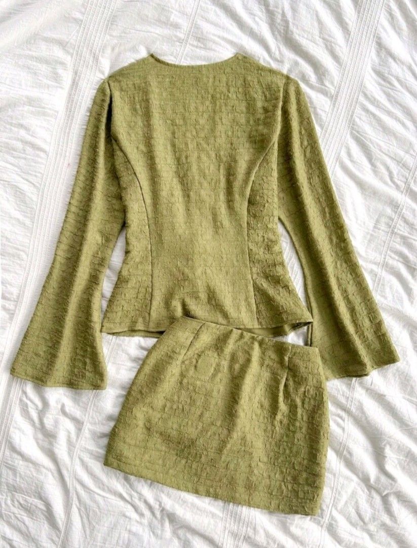 SHEIN Top and Skirt Set (Category: Sets or Coordinates) located in Makati City. Submitted by maaarrrjjjj (Listing ID 1470187463, Image 2). Description: - Brand: SHEIN - Style: two-piece set (long flare-sleeve top with front ties + matching mini skirt) - Material: Crinkled fabric - Size: XS (tags attached) - Condition: Brand new, never worn out NOTE: color on actual photo may slightly differ due to lighting.