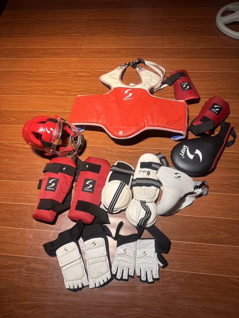Shift Taekwondo Sparring Gear Complete Set Red White (Category: Combat Sports) located in Agdangan. Submitted by samuelaalm30788 (Listing ID 1470210696, Image 1). Description: - Brand: Shift Martial Arts - Color Scheme: Red and white with black straps and elastic bands - Condition: Ready for sparring practice and tournaments - Complete Set Includes: - Red chest guard (Size 2) - Red headgear with face shield - Arm guards - Shin guards - Hand glove
