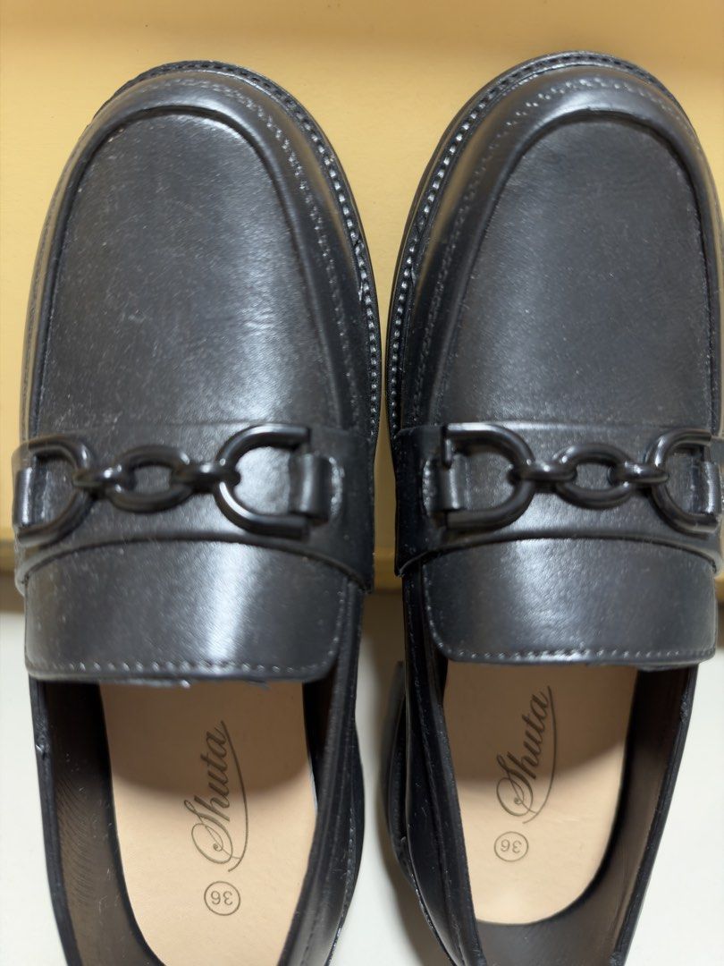 Shuta Black Chain Loafers Size 36 (Category: Loafers) located in Manila. Submitted by thrifty82 (Listing ID 1470151524, Image 2). Description: - Brand: Shuta - Size: EU 36 - Color: Classic Black (rubberized) - Style: Slip-on loafers with chic black chain detail - Design: Round toe with neat stitched edging - Condition: Excellent, clean uppers and insoles with minimal signs of handling - Perfect for work, school, or casual day-outs - Message me fo
