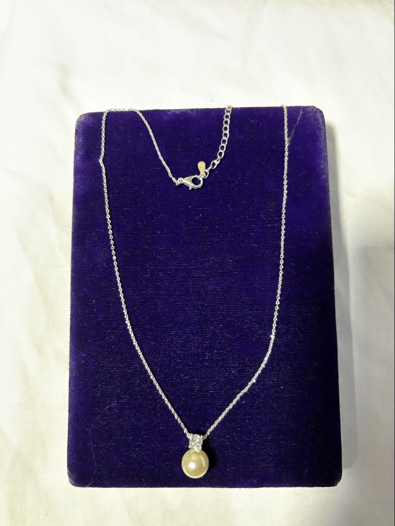 Silver Pendant Necklace with Pearl (Category: Necklaces) located in Caloocan City. Submitted by berndale_closet (Listing ID 1470170460, Image 1). Description: - Material: 925 stamped silver-toned chain - Pendant: Single round white pearl with delicate crystal accents - Closure: Adjustable lobster clasp - Length: Approx. 9 inches when laid flat - Style: Simple, classic, and elegant Japan Sourced.
