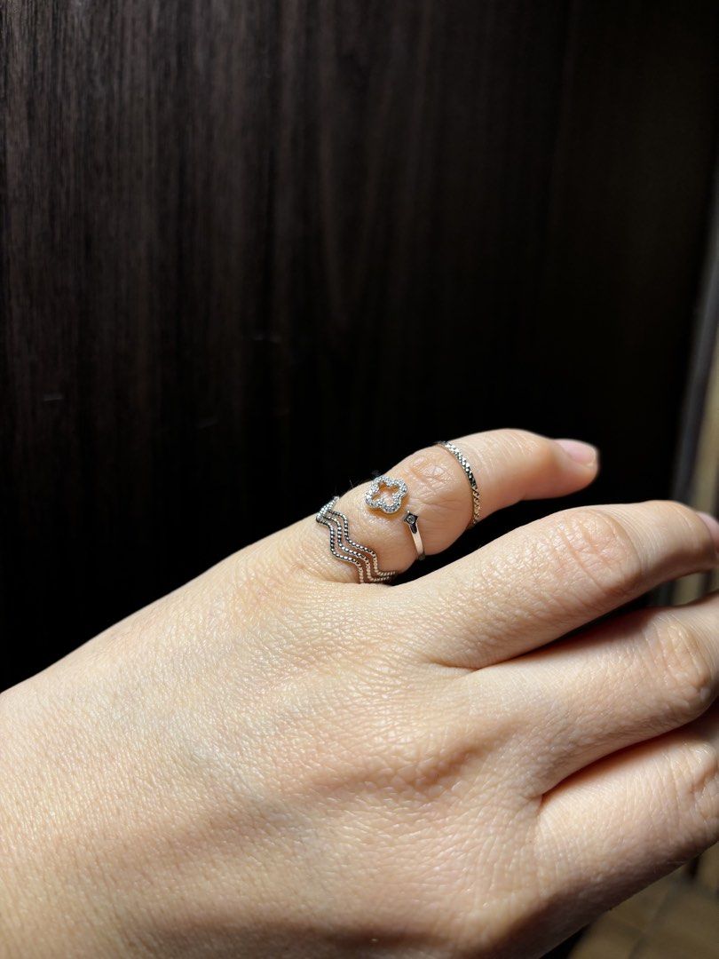 Silver Rings Set with Clover and Wave Designs (Category: Rings) located in Caloocan City. Submitted by berndale_closet (Listing ID 1470164769, Image 1). Description: - Style: Silver-toned stacking ring set with sparkling stone details - Pieces: Includes a clover motif ring, textured wavy band, and simple geometric bands - Size: smallest US size 6 , 2pcs are adjustable - Versatility: Wear them stacked together or separately on different fingers - 
