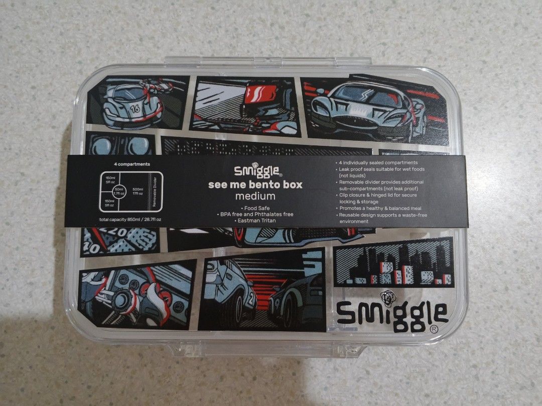 Smiggle See Me Bento Box Medium Race Car Design (Category: Babies & Kids Fashion) located in Lapu Lapu. Submitted by dawatkrist14304 (Listing ID 1470296523, Image 1). Description: - Brand new with original cardboard sleeve - Fun race car comic graphic design - 850ml total capacity with 4 individually sealed compartments - Removable divider for customizable lunch packing - Secure clip closure and hinged lid design - Food-safe, BPA, and phthalates-