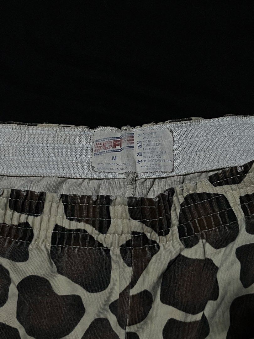 Soffe Giraffe Print Cotton Boxer Shorts (Category: Shorts) located in Manila. Submitted by y2kcloset_ (Listing ID 1470182522, Image 3). Description: - Brand: Soffe - Style: Boxer shorts with all-over giraffe print - Size: Medium - Material: 100% combed cotton for ultimate comfort - Waistband: White elastic band - Origin: Made in El Salvador - Condition/Details: Wash care tag attached inside waist.