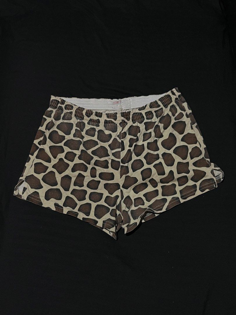 Soffe Giraffe Print Cotton Boxer Shorts (Category: Shorts) located in Manila. Submitted by y2kcloset_ (Listing ID 1470182522, Image 1). Description: - Brand: Soffe - Style: Boxer shorts with all-over giraffe print - Size: Medium - Material: 100% combed cotton for ultimate comfort - Waistband: White elastic band - Origin: Made in El Salvador - Condition/Details: Wash care tag attached inside waist.