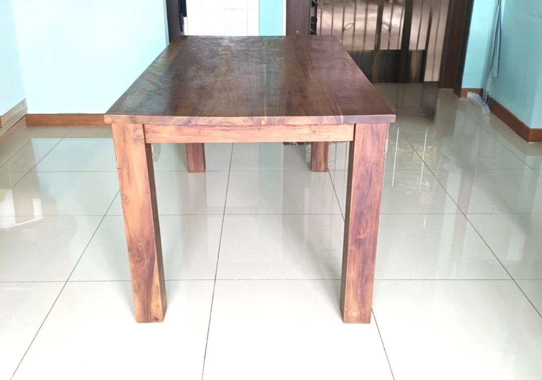 Solid Wood Rectangular Table (Category: Tables & Sets) located in Singapore. Submitted by palani.sg (Listing ID 1470165558, Image 1). Description: ***Self Collect*** - Material: Solid wood with rich brown grain finish - Design: Sturdy 4-leg construction, clean rectangular shape - Surface: Smooth with natural wood patterns - Use: Standard height dining or kitchen table - Condition: Well-maintained classic furniture piece.