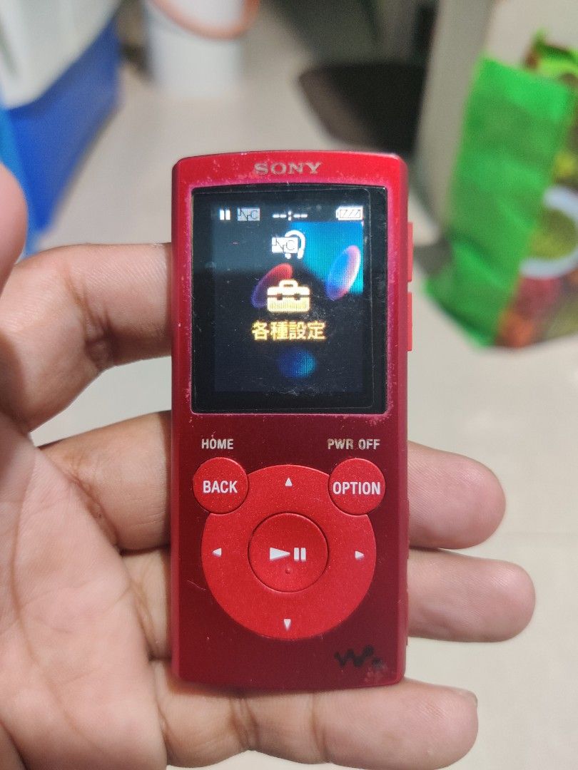 Sony Walkman NW-E062 Red Digital Music Player (Category: Portable Music Players) located in Quezon City. Submitted by bbert203 (Listing ID 1470199686, Image 1). Description: - Model: Sony Walkman NW-E062 (Red) - Compact, pocket-sized digital music player - Features a color screen and easy physical control buttons - Verified authentic with model and serial numbers on the back - Screen turns on and menus navigate normally - Shows typical wear marks
