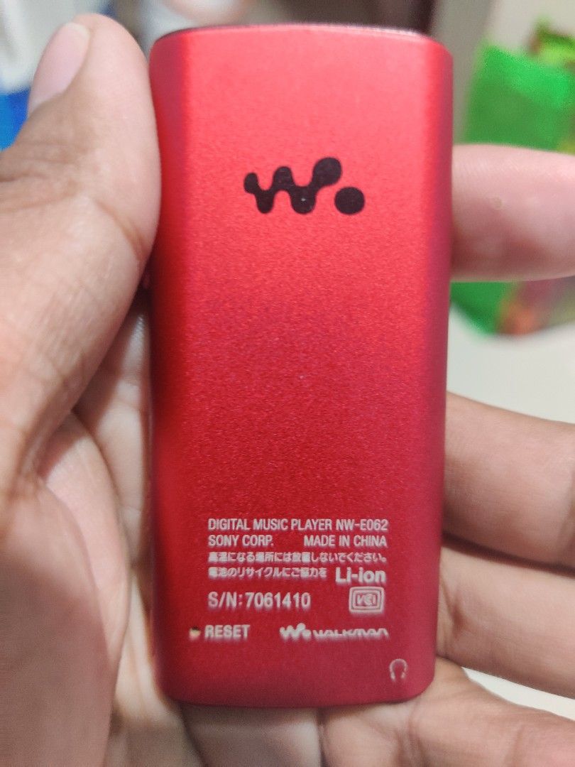 Sony Walkman NW-E062 Red Digital Music Player (Category: Portable Music Players) located in Quezon City. Submitted by bbert203 (Listing ID 1470199686, Image 3). Description: - Model: Sony Walkman NW-E062 (Red) - Compact, pocket-sized digital music player - Features a color screen and easy physical control buttons - Verified authentic with model and serial numbers on the back - Screen turns on and menus navigate normally - Shows typical wear marks