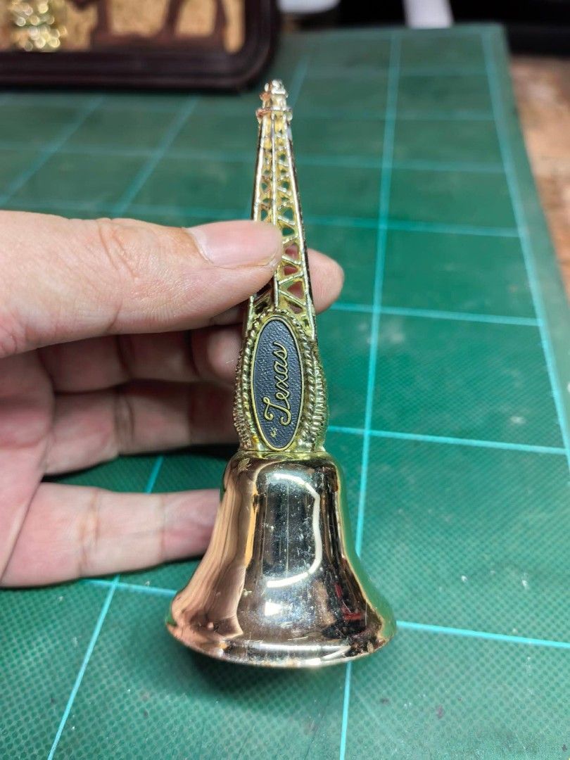 Souvenir Bell (Category: Other Home Decor) located in Cebu City. Submitted by dudes_villanueva (Listing ID 1470248972, Image 1). Description: Gold-Tone Texas Oil Derrick Souvenir Bell Excellent condition.