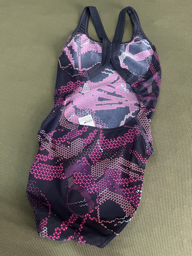 Speedo Endurance One Piece Swimsuit (Category: Bikinis & Swimsuits) located in Taguig. Submitted by graceeeee. (Listing ID 1470157965, Image 2). Description: Speedo Hyperboom Swimsuit - Brand: Speedo - Style: One-piece racerback with thick supportive straps - Color/Design: Dark navy base with vibrant pink and orange geometric triangle print - Condition: Used a few times, no issues Loc: next to Venice Mall, Taguig Shipping J&T/Lalamove/Grab or mee