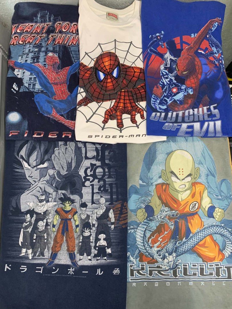 Spider-Man and Dragon Ball Graphic T-Shirts Bundle (Category: Tshirts & Polo Shirts ) located in Angeles City. Submitted by calmstar_407931 (Listing ID 1470332950, Image 1). Description: - Bundle of 5 graphic tees for comic and anime fans - 3 Spider-Man designs with classic comic and movie prints - 2 Dragon Ball designs featuring Goku, Krillin, and character rosters - Assorted colors: dark blue, white, bright blue, and grey-green - Comfortable st