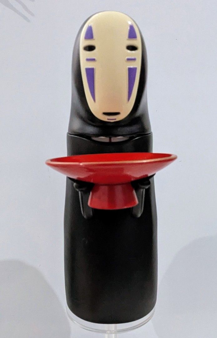 Spirited Away No Face Coin Bank (Category: Figurines & Statues) located in Quezon City. Submitted by furbous (Listing ID 1470263810, Image 1). Description: - Authentic Studio Ghibli No Face coin bank from Spirited Away - Interactive feature: mouth opens wide when you place a coin on the red dish - Stands upright securely on a circular base - Great collectible for anime fans and kids learning to save - Clean, well-maintained condition with smooth 