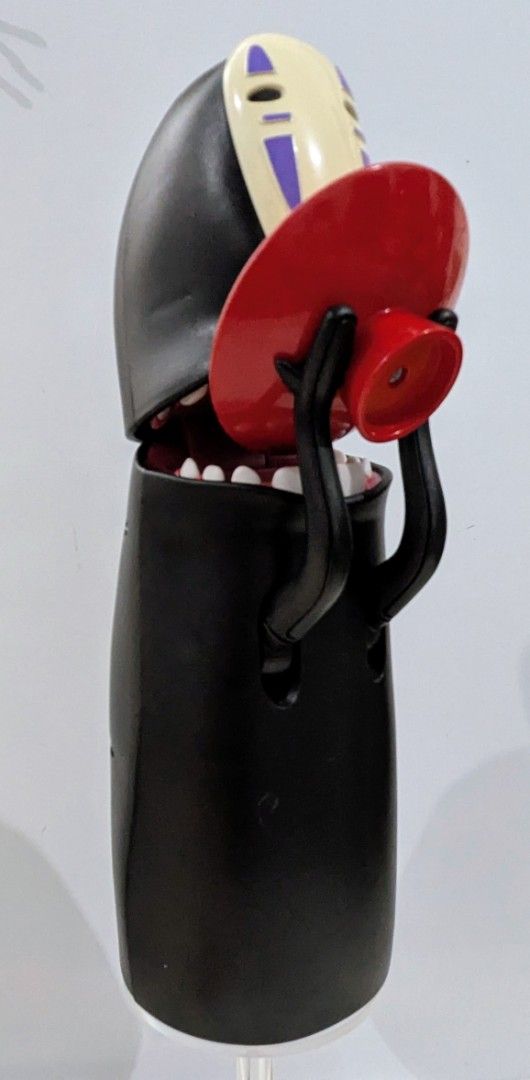 Spirited Away No Face Coin Bank (Category: Figurines & Statues) located in Quezon City. Submitted by furbous (Listing ID 1470263810, Image 2). Description: - Authentic Studio Ghibli No Face coin bank from Spirited Away - Interactive feature: mouth opens wide when you place a coin on the red dish - Stands upright securely on a circular base - Great collectible for anime fans and kids learning to save - Clean, well-maintained condition with smooth 