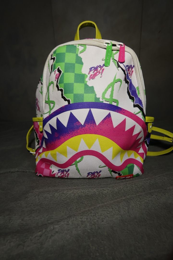 Sprayground Dreamy Technicolor Savage Backpack (Category: Backpacks) located in Victoria. Submitted by manoguidma85750 (Listing ID 1470172532, Image 1). Description: Authentic Sprayground Dreamy Technicolor Savage Mini Backpack.