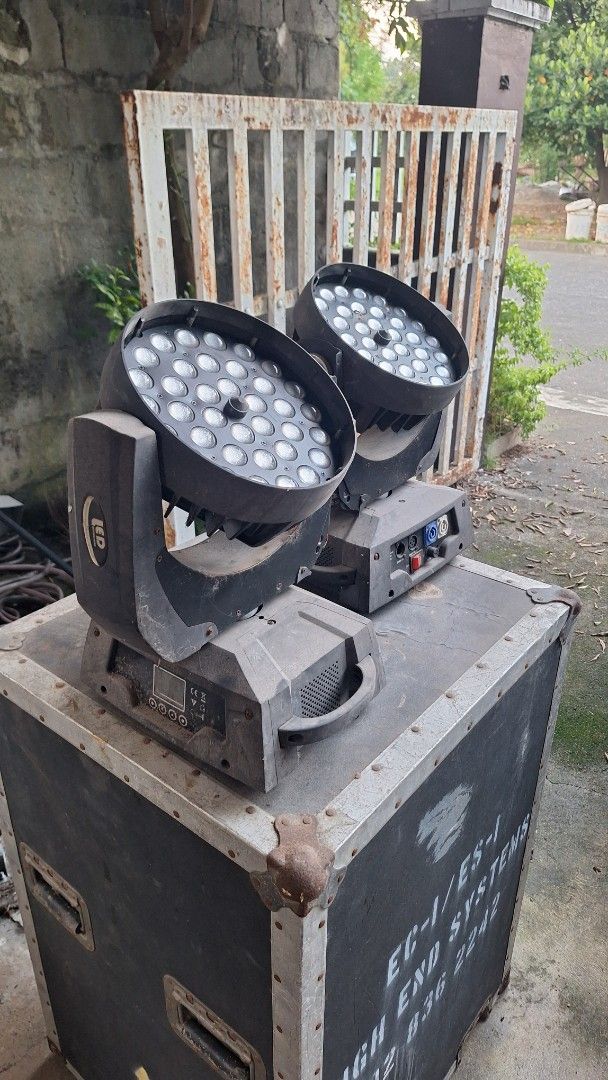 Stage LED Moving Head Lights with Flight Case (Category: Lighting & Studio Equipment) located in Angeles City. Submitted by pamdiel003 (Listing ID 1470241390, Image 3). Description: - Dual moving head LED stage lights mounted in a heavy-duty flight case - Multi-lens array on each unit for dynamic stage lighting effects - Equipped with standard PowerCon inputs and DMX in/out ports - Powers up successfully using standard connectors - Condition note