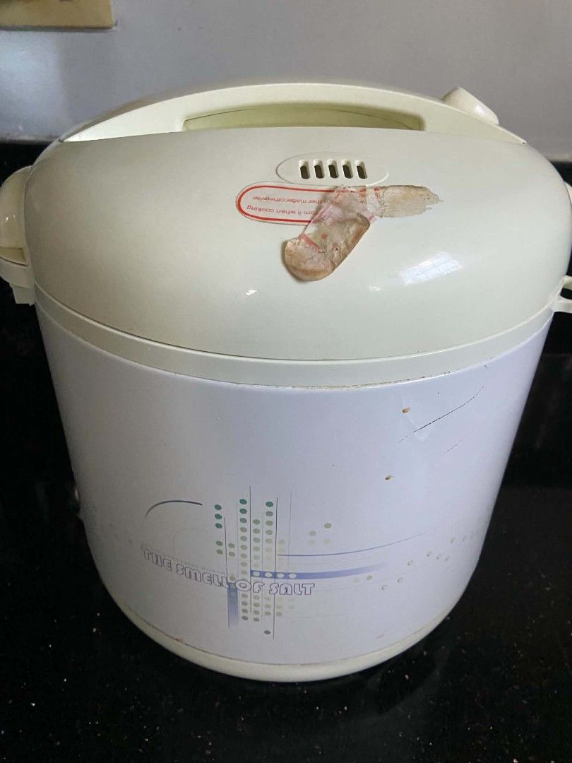 Standard Electric Rice Cooker (Category: Cookers) located in Quezon City. Submitted by rapstoreph (Listing ID 1470158401, Image 3). Description: - Brand: Standard - Color: White and cream with 'The Smell of Salt' graphic print - Features: Cook and warm indicator lights with a simple lever switch - Condition: Powers up properly via standard plug; has some minor wear marks and tape residue on the exterior - Perfect for everyday cooking needs!.