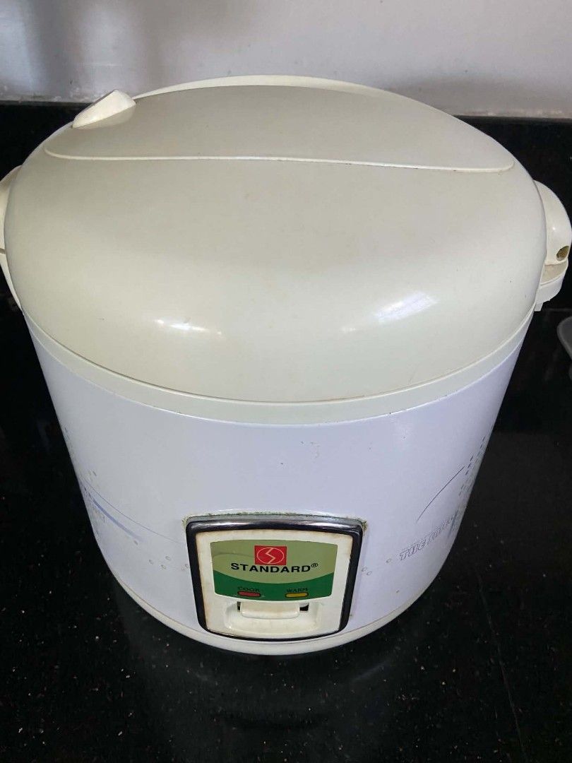 Standard Electric Rice Cooker (Category: Cookers) located in Quezon City. Submitted by rapstoreph (Listing ID 1470158401, Image 1). Description: - Brand: Standard - Color: White and cream with 'The Smell of Salt' graphic print - Features: Cook and warm indicator lights with a simple lever switch - Condition: Powers up properly via standard plug; has some minor wear marks and tape residue on the exterior - Perfect for everyday cooking needs!.