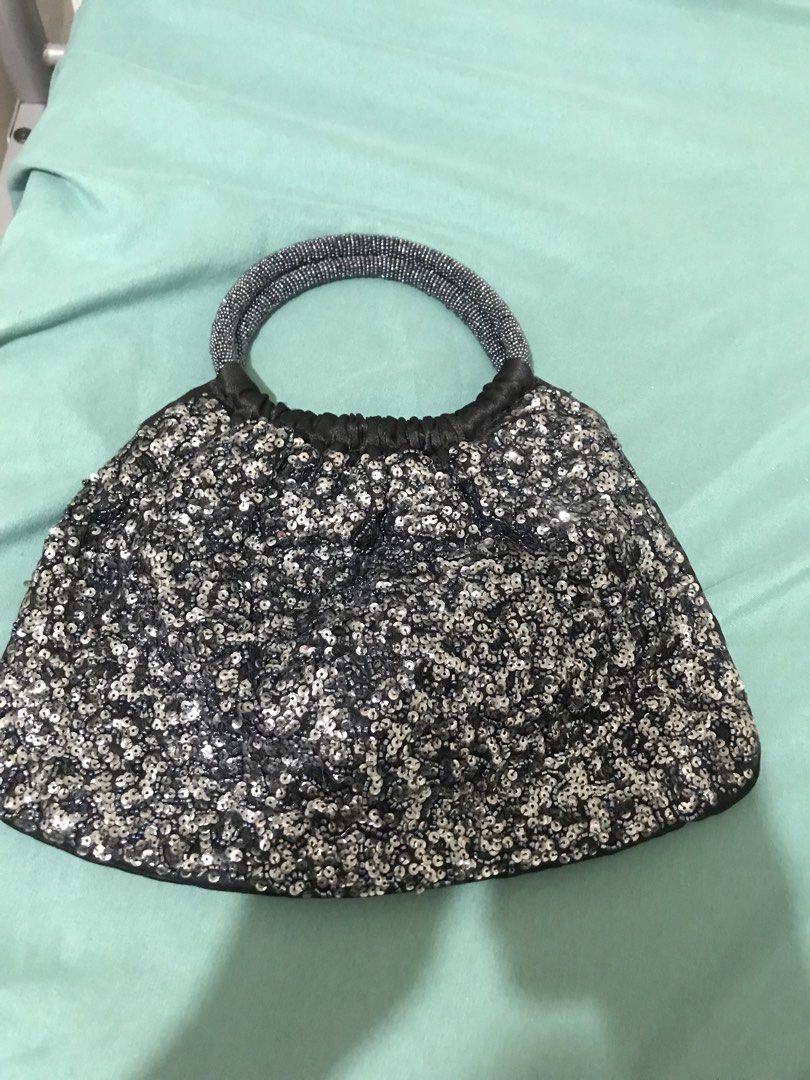 Stella shimmer (Category: Purses & Pouches) located in Balete No 2. Submitted by troyesybang (Listing ID 1470172439, Image 1). Description: Beaded and seuined HandbaG Zipper closure Zippered inside pocket too.