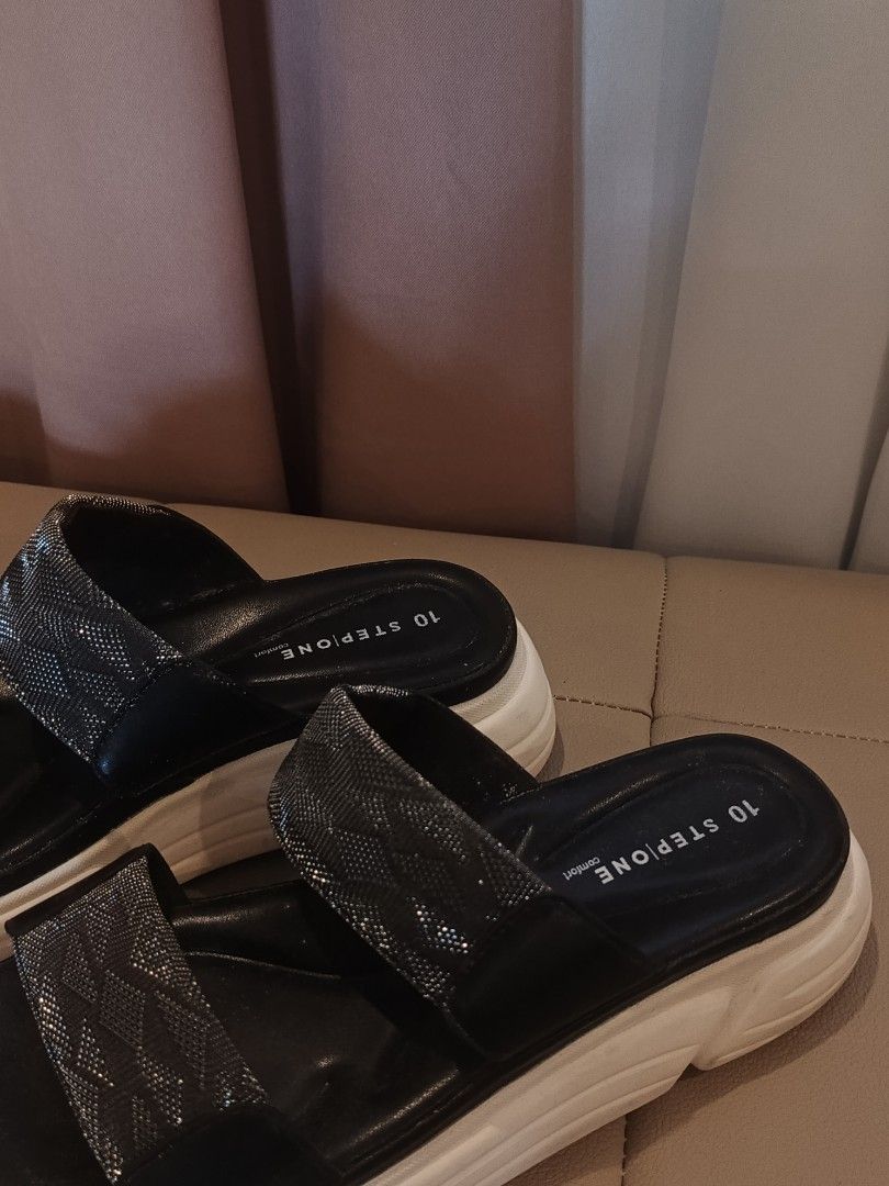 Stepone Comfort Platform Sandals Black (Category: Sandals) located in Arayat. Submitted by akahana_ (Listing ID 1470225529, Image 2). Description: - Brand: Stepone Comfort - Style: Platform sandals with chunky white soles - Design: Double strap with sparkly metallic patterned bands - Comfort: Cushioned footbed with branding on the heel - Color: Black and white - Inclusion: Original shoe box included - Condition: Excellent/Ready to wear - Mode of 