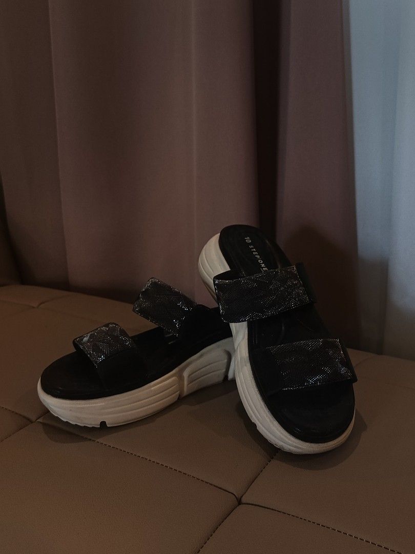Stepone Comfort Platform Sandals Black (Category: Sandals) located in Arayat. Submitted by akahana_ (Listing ID 1470225529, Image 1). Description: - Brand: Stepone Comfort - Style: Platform sandals with chunky white soles - Design: Double strap with sparkly metallic patterned bands - Comfort: Cushioned footbed with branding on the heel - Color: Black and white - Inclusion: Original shoe box included - Condition: Excellent/Ready to wear - Mode of 