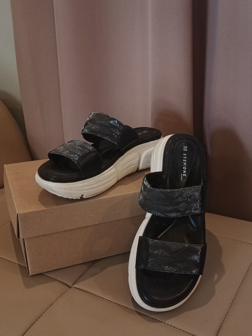 Stepone Comfort Platform Sandals Black (Category: Sandals) located in Arayat. Submitted by akahana_ (Listing ID 1470225529, Image 3). Description: - Brand: Stepone Comfort - Style: Platform sandals with chunky white soles - Design: Double strap with sparkly metallic patterned bands - Comfort: Cushioned footbed with branding on the heel - Color: Black and white - Inclusion: Original shoe box included - Condition: Excellent/Ready to wear - Mode of 
