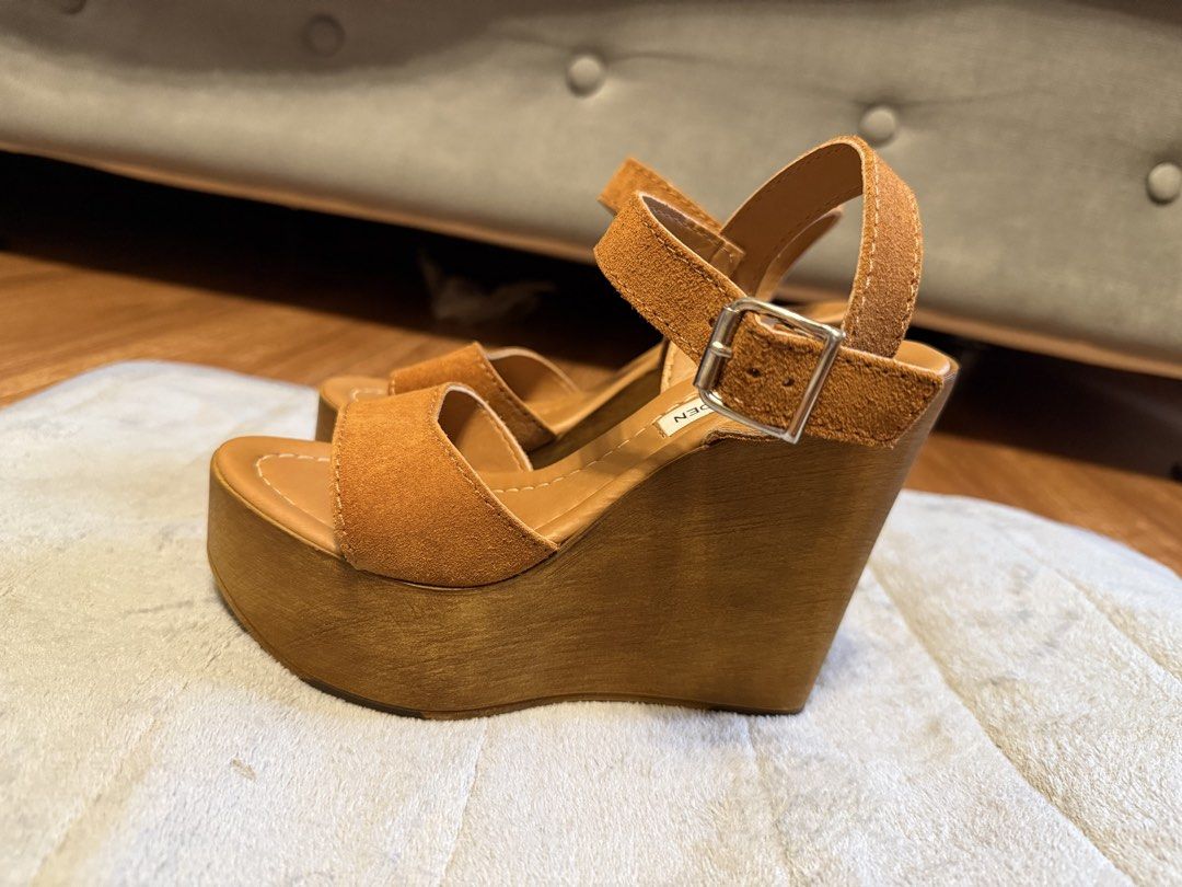 Steve Madden Brown Suede Wedge Sandals (Category: Wedges) located in Angeles City. Submitted by missluxxe888 (Listing ID 1470347940, Image 3). Description: - Brand: Steve Madden - Material: Brown Suede - Style: Wedge Sandals - Features: Ankle straps with buckle closure, platform wedge heel - Comfort: Comfortable for all-day wear - Versatility: Dress up or down, suitable for any occasion .