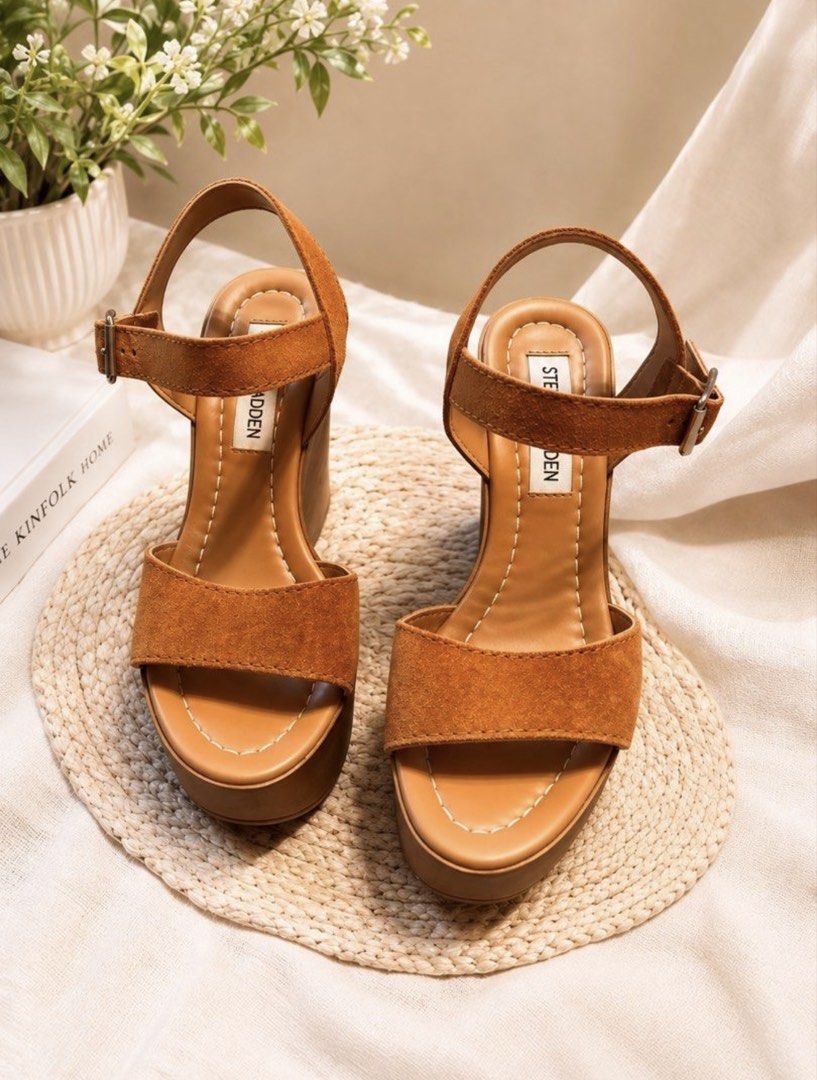Steve Madden Brown Suede Wedge Sandals (Category: Wedges) located in Angeles City. Submitted by missluxxe888 (Listing ID 1470347940, Image 1). Description: - Brand: Steve Madden - Material: Brown Suede - Style: Wedge Sandals - Features: Ankle straps with buckle closure, platform wedge heel - Comfort: Comfortable for all-day wear - Versatility: Dress up or down, suitable for any occasion .