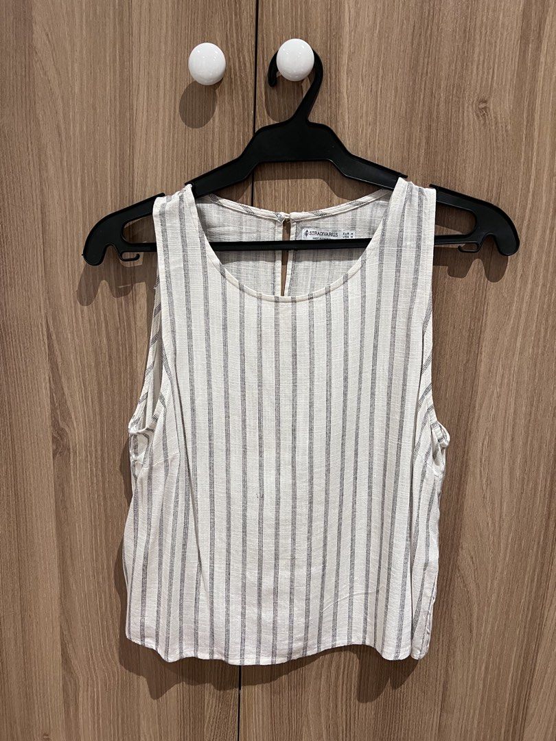 STRADIVARIOUS Striped Sleeveless Tank Top (Category: Sleeveless) located in Manila. Submitted by sph_preloved (Listing ID 1470212375, Image 1). Description: Price not negotiable unless buying at least 5 items. No ww photos. Location: QC Mode of delivery: grab/lalamove SF to be shouldered by the buyer .