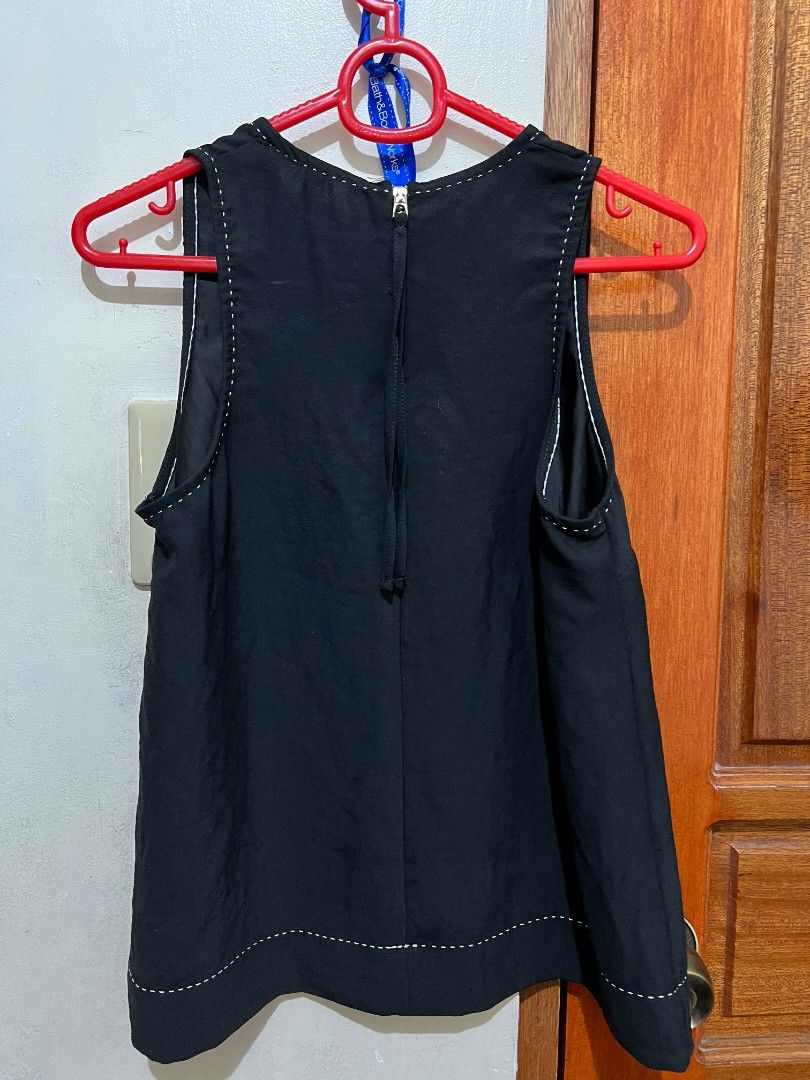 Stradivarius Black Sleeveless Top Size M (Category: Dresses) located in Quezon City. Submitted by caramianns (Listing ID 1470243035, Image 3). Description: - Brand: Stradivarius - Style: Black sleeveless dress with contrast white stitching along the neckline, armholes, and hem - Closure: Back zipper for easy wear - Fit: Clean look with a simple, flattering cut - Size: EUR M, USA M, MEX 28 - Condition: Excellent.