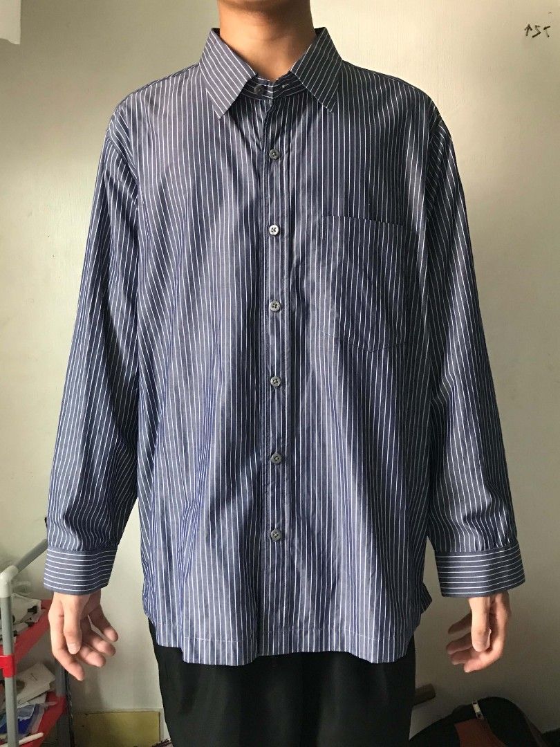 Striped Long-Sleeve Button-Down Shirt 🖤🤍 (Category: Tshirts & Polo Shirts ) located in Paranaque City. Submitted by genxie_ (Listing ID 1470209546, Image 1). Description: Striped Long-Sleeve Button-Down Shirt 🖤🤍 - Color: Dark gray/navy with white vertical stripes - No brand / no tags - Condition: Good condition - No fading or discoloration - Long sleeves with striped cuffs - With front pocket - Classic collar and button-down design Measuremen