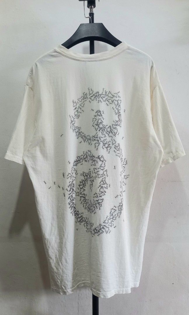 Stussy Ant Graphic White Tee Size M (Category: Tshirts & Polo Shirts ) located in Tarlac. Submitted by den420 (Listing ID 1470220192, Image 1). Description: - Brand: Stussy - Style: Crewneck t-shirt with short sleeves and standard fit - Color: White - Size: M (tag attached) - Material: 100% cotton, made in Guatemala - Design: Unique ant graphic spelling the Stussy logo on the front and a swirl design on the back - Condition: Like new with tags.