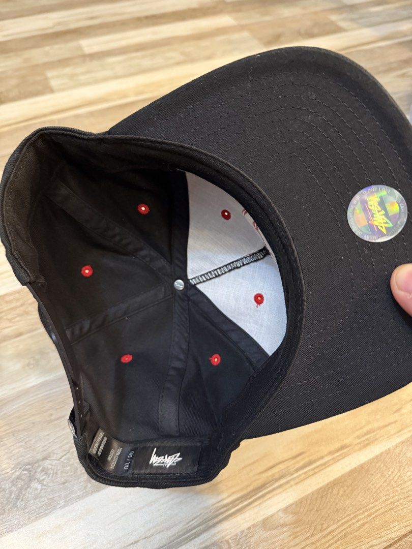 Stussy link cap (Category: Caps & Hats) located in Manila. Submitted by safeowl.b6dbb0 (Listing ID 1470337331, Image 2). Description: - Authentic Stussy black baseball cap - Bold red embroidered logo on the front - Matching red eyelets and top button - Adjustable snapback closure for a custom fit - 100% premium cotton material with interior tag - Features hologram authenticity sticker on the brim - Clean interior lining with white front panels - 
